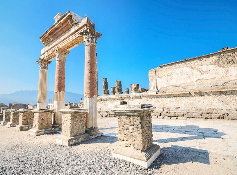 Ruins of Temple of Jupiter in Pompeii with tall stone columns