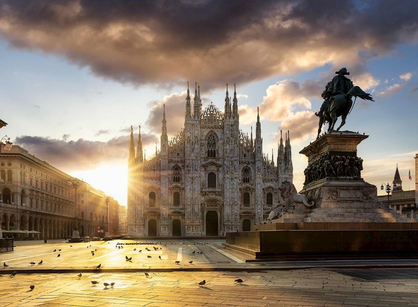 Vittorio Emanuele II statue in Piazza del Duomo with Milan Cathedral at sunrise