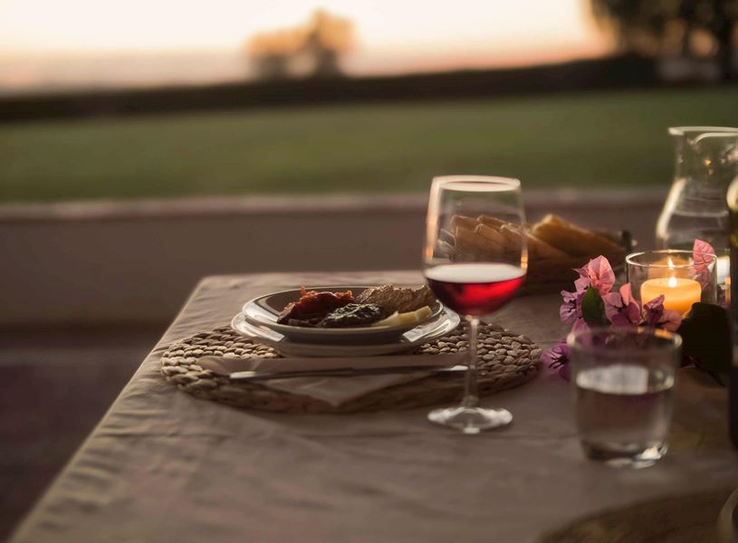 A candlelit table with wine and bread in Florence, Italy