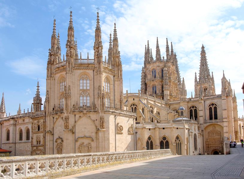 Burgos Cathedral with intricate Gothic spires and detailed stone facade in Spain