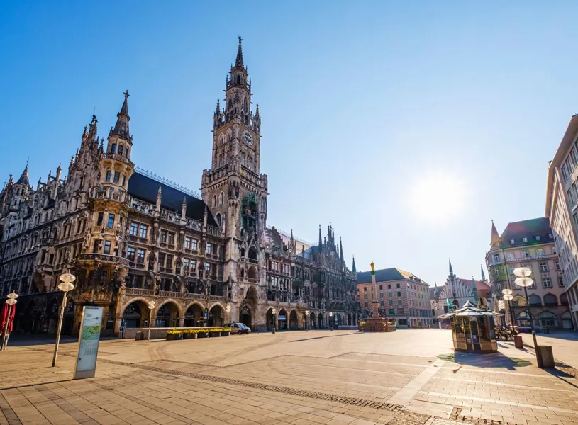 Sun shining over deserted Marienplatz, Bavaria, Munich, Germany